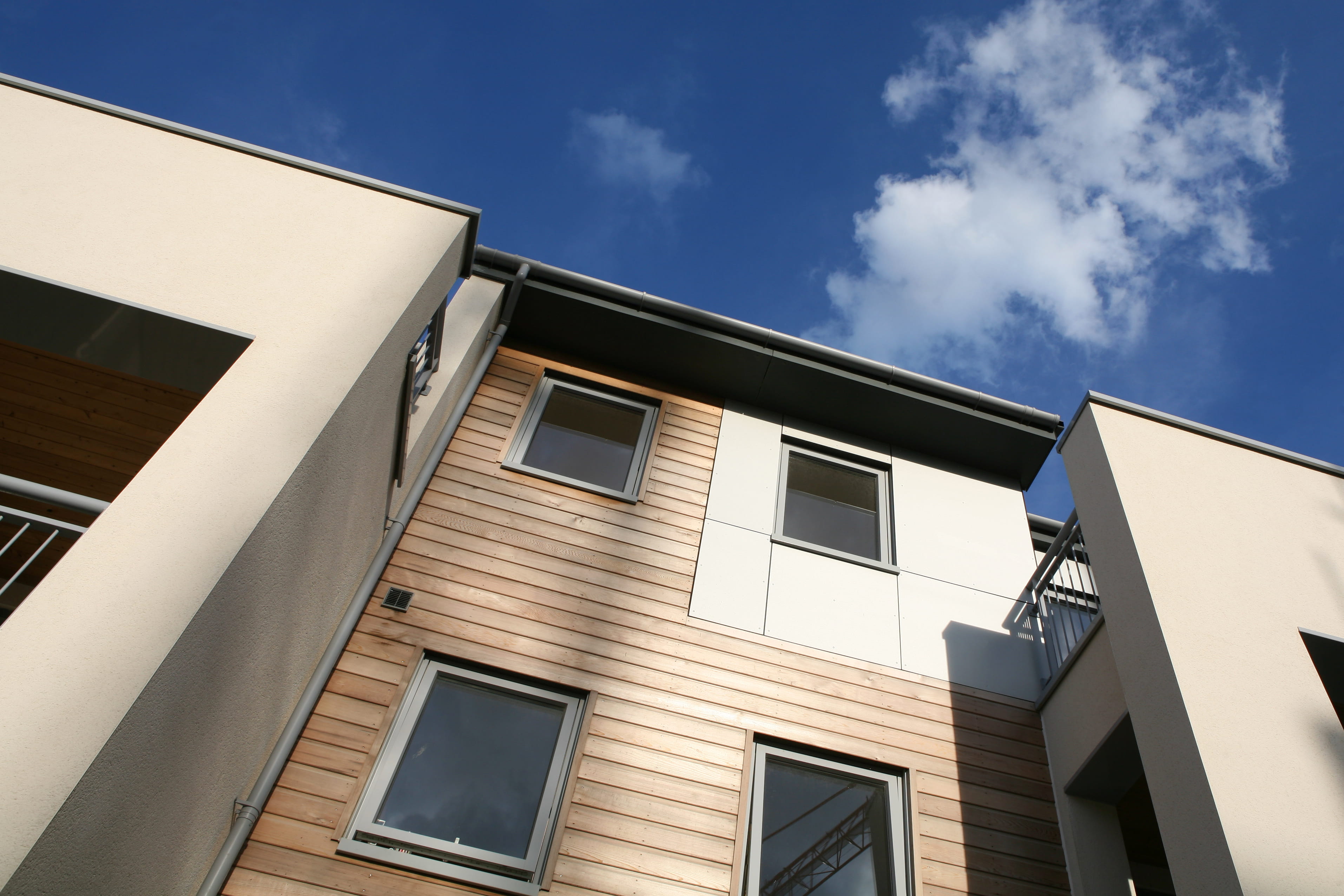 A house exterior clad in timber-effect boards